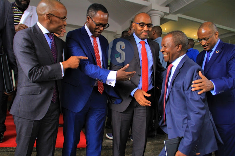 Safaricom Boss peter Ndegwa, NCBA bank CEO Jonh Gachora, KCB Bank CEO Paul Russo, Central Bank of Kenya governor Patrick Njoroge and treasury nominated cabinet secretary Njuguna Ndung'u in a discussion after the president left Norfolk Hotel after a briefing on September 28,2022.