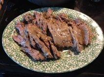 Swiss Steak Sliced with gravy drizzled on top