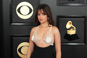 Actress and singer Camila Cabello puts a risqué spin to her glamorous look.