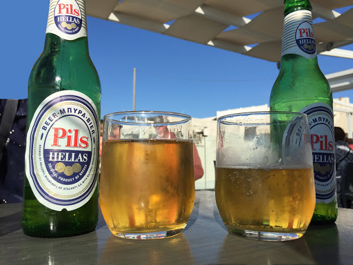 Pils-Hellas.jpg - Pils Hellas from Hellanic Breweries during a stop in Santorini, Greece, on a Viking Star cruise. The views were better than the beer.