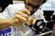 CANDY MAN: Pastry chef Nicolas van der Walt creates a 2cm-square chocolate painting at the SA Sweet and Snack Expo, held at The Dome, Johannesburg, at the weekend. The expo attracted 50 domestic and foreign exhibitors