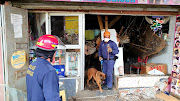 Police and rescue teams search through the rubble of a collapsed room at a building in the Durban CBD on Thursday. Nine people were injured.