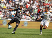  Orlando Pirates Sandile Mthethwa fights for the ball possession with Iqraam Rayners of Stellenbosch FC on their MTN 8 semi-final at Orlando Stadium in Soweto.