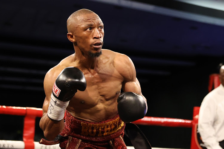 Gideon Buthelezi waits for Dave Apolinario's next move during the Vacant IBO Flyweight World Title bout held at the ICC.