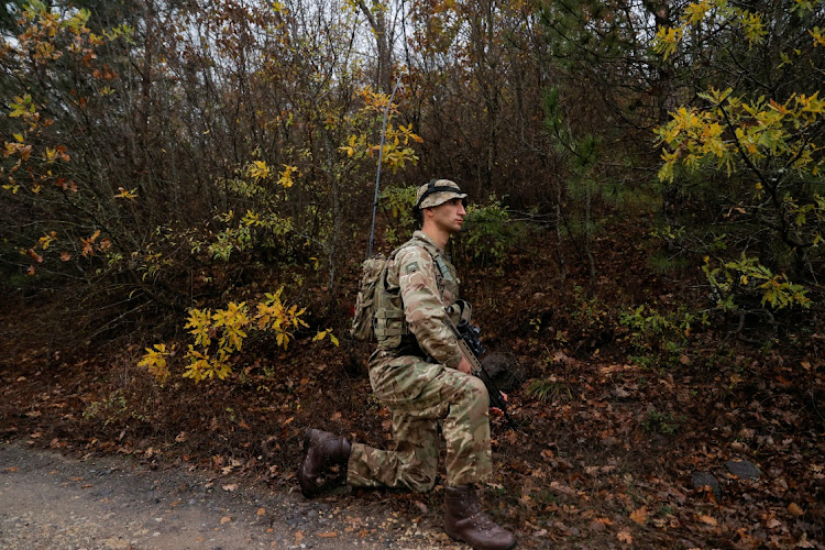 A British soldier part of the NATO reinforcements patrols at the Kosovo-Serbia border in Jarinje, Kosovo November 24, 2023.