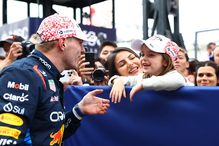 Race winner Max Verstappen of the Netherlands and Oracle Red Bull Racing celebrates with Penelope Piquet in parc ferme during the F1 Grand Prix of Japan at Suzuka International Racing Course. Picture: MARK THOMPSON