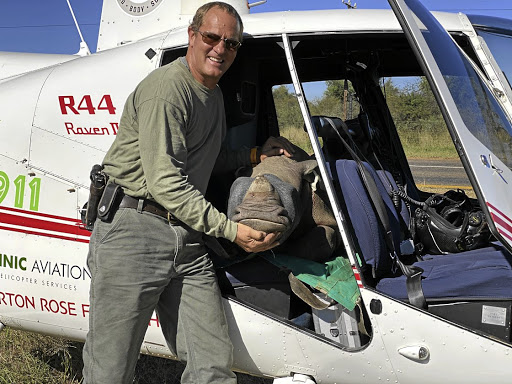 Nico Jacobs of Rhino 911 with four-month-old Jessie, evacuated on April 30 after her mother was poached in the North West.