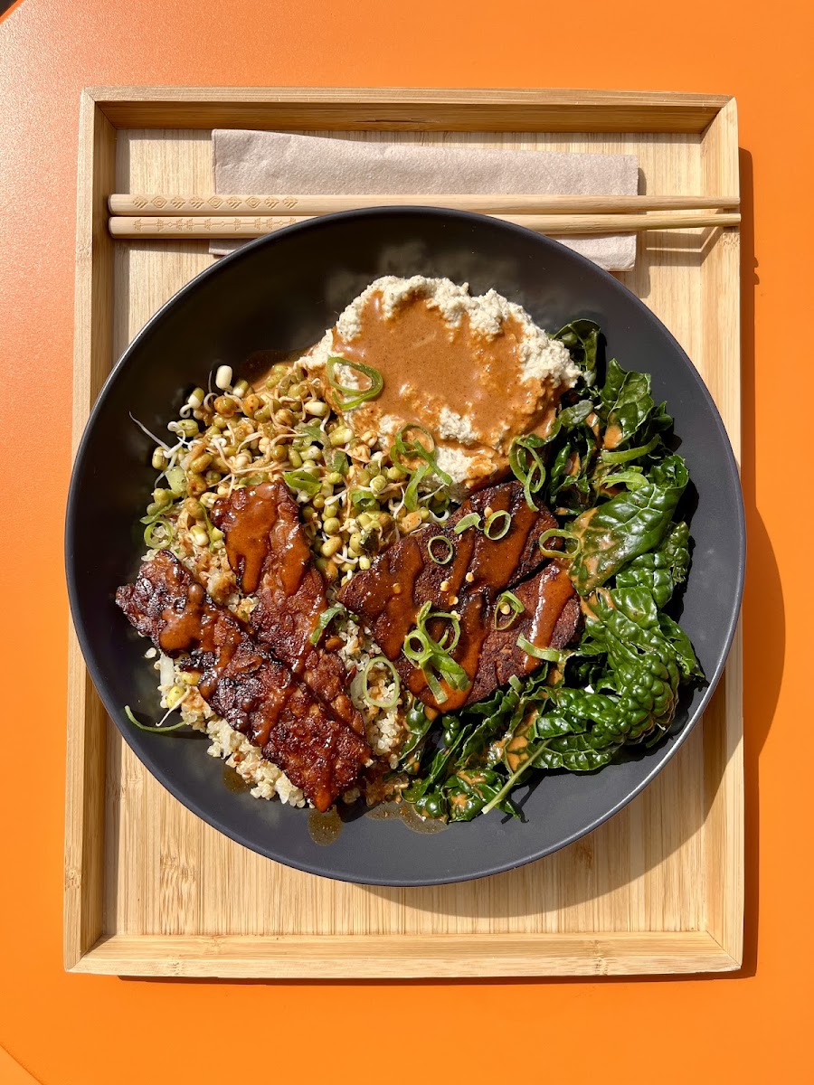 Our Protein Bowl is a luscious power-boost featuring quinoa tabouleh, organic sprouted mung bean salsa, chickpea hummus, organic tempeh and tofu, organic greens, and tumeric tahini dressing. Totally gluten-free.