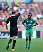 Olaleng Shaku of Baroka receive a yellow card from Referee Christopher Harrison during the Absa Premiership 2017/18 football match between Baroka and Bidvest Wits at Peter Mokaba Stadium, Polokwane on 22 October 2017.