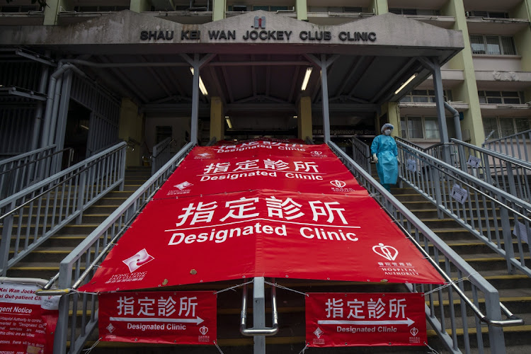 Banners for a clinic designated for Covid-19 patients in Hong Kong, China on Friday, February 18 2022. Picture: BLOOMBERG/PAUL YEUNG