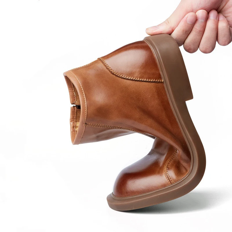 Heren leren Martin enkellaarsjes met ronde neus, duurzaam en comfortabel, ideaal voor een casual en veelzijdige stijl.