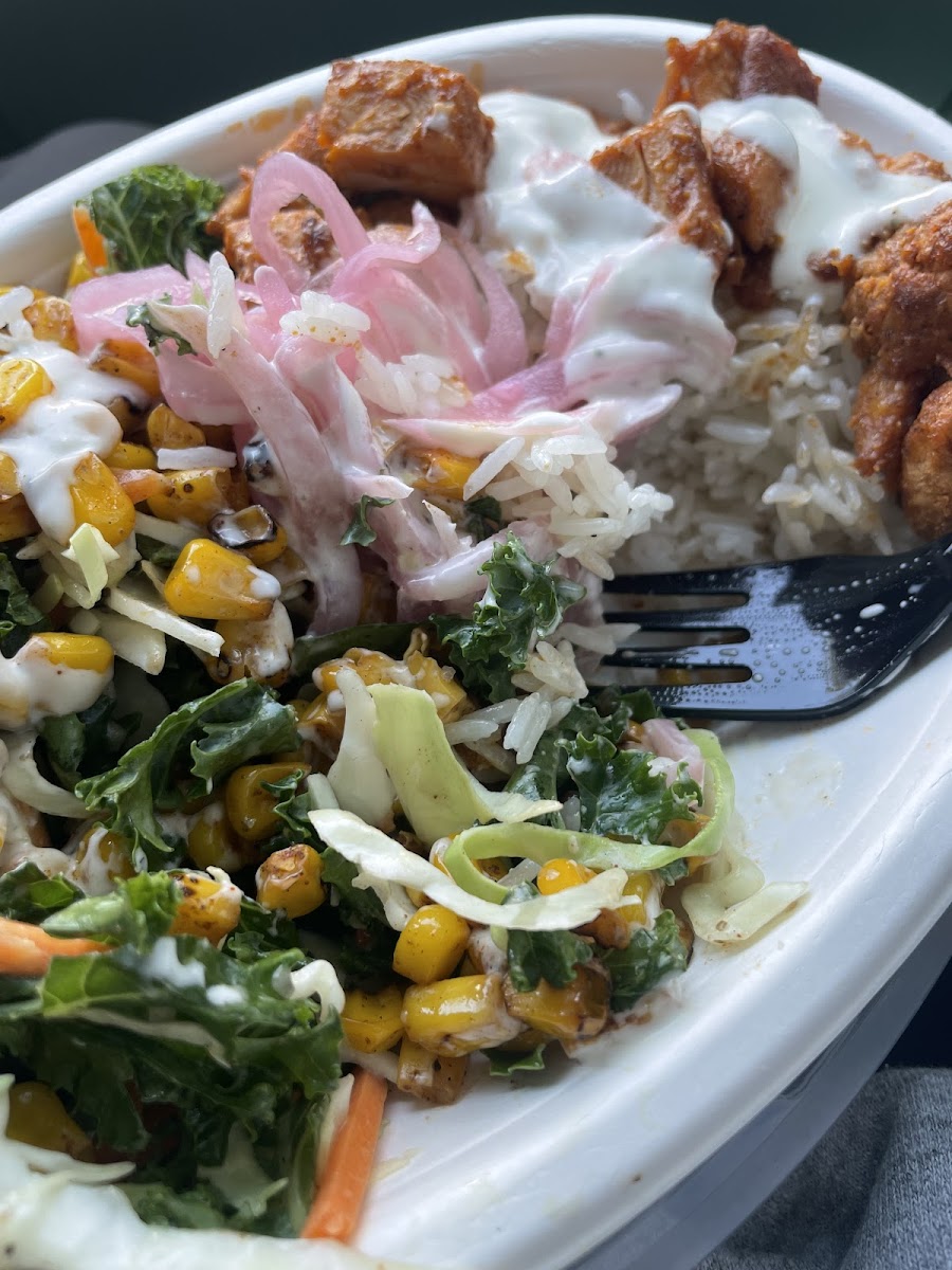 Summer BBQ Bowl with the base of jasmine rice and almond kale salad