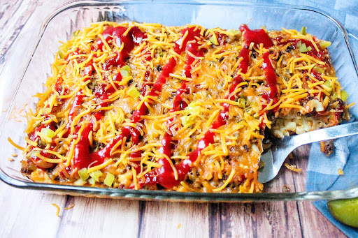 Removing a slice of the Cheeseburger Casserole.