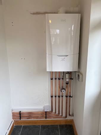 Combi boiler replacement in new location  album cover