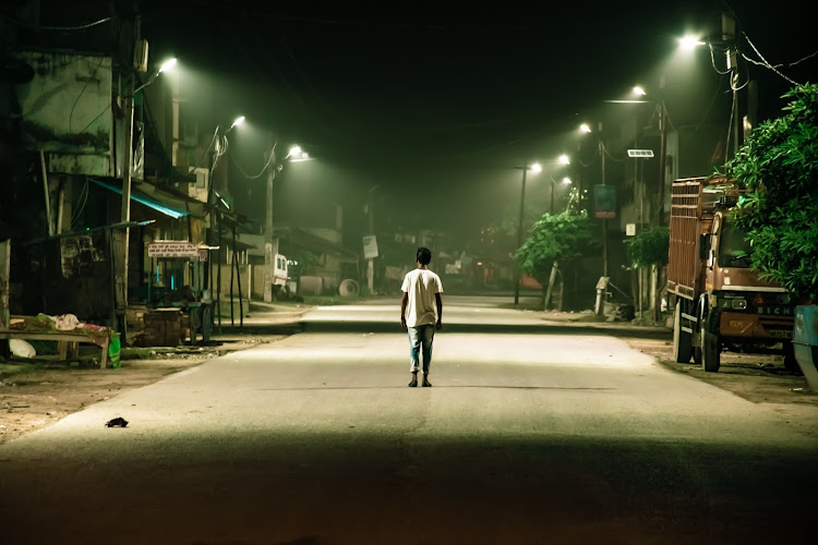 A man walks in a deserted town