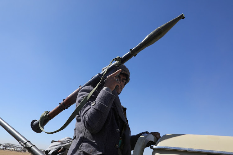 A tribal supporter of Yemen's Houthis carries an RPG launcher during a protest against recent US-led on against Houthi targets, near Sanaa, Yemen, on January 14 2024.