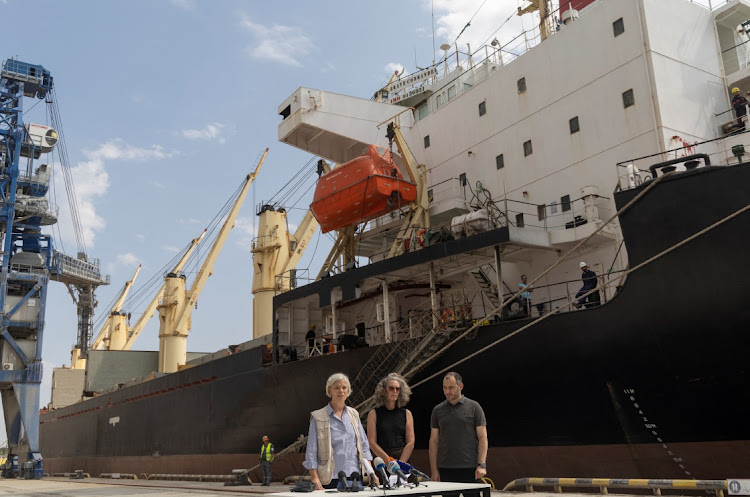 UN official Denise Brown, deputy country director at World Food Programme Marianne Ward and Ukraine infrastructure minister Oleksandr Kubrakov in font of the Brave Commander bulk carrier, in the port of Pivdennyi in Yuzhne, southern Ukraine, August 14 2022. Picture: VALENTYN OGIRENKO/REUTERS