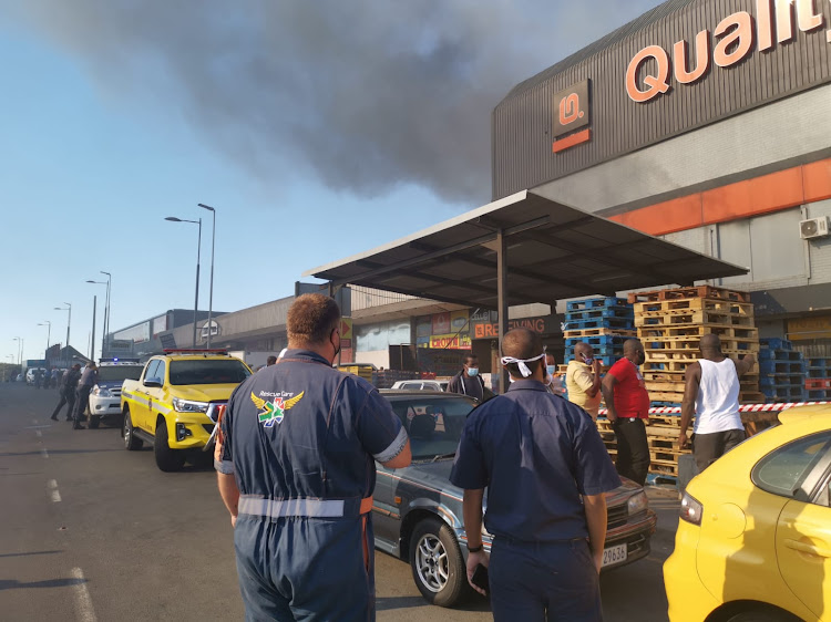 Paramedics and police officers were at the scene while a supermarket in Pinetown was on fire on Monday morning