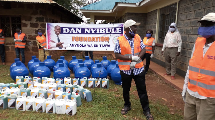 Businessman Dan Nyibule distributes sanitiser, face masks and water tanks to curb the spread of Covid-19.