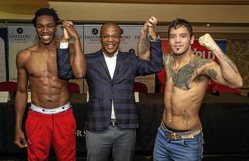 BSA CEO Tsholofelo Lejaka is sandwiched by Thulani Mbenge and Diego Chaves after the two boxers' pre-fight medical at Emperors Palace, Kempton Park yesterday.