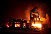 A home burns during a wildfire that claimed dozens of homes in Thousand Oaks, California, US November 9, 2018. 