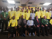 The South African Under-23 side pose for a team picture on their arrival at OR Tambo International Airport on Saturday from the U-23 Africa Cup of Nations in Egypt, where they finished third to qualify for the 2020 Olympics in Tokyo. Bafana Bafana coach Molefi Ntseki (centre, left), U-23 coach David Notoane (centre) and Safa president Danny Jordaan (centre, right) are in the front row. 