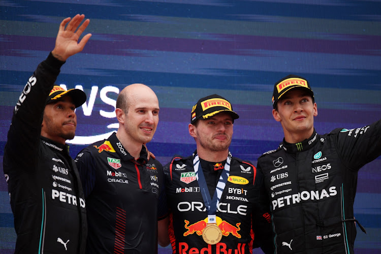 Race winner Max Verstappen of the Netherlands and Oracle Red Bull Racing, centre, second placed Lewis Hamilton of Great Britain and Mercedes, left, third placed George Russell of Great Britain and Mercedes, right, and David Mart, lead powertrains engineer at Red Bull Racing celebrate on the podium at Circuit de Barcelona-Catalunya in Barcelona, Spain, June 4 2023. Picture: ADAM PRETTY/GETTY IMAGES