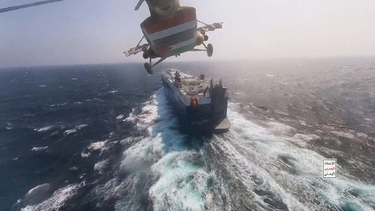 A Houthi helicopter flies over the 'Galaxy Leader' cargo ship in the Red Sea in this photo released on November 20 2023. Picture: HOUTHI MILITARY MEDIA/REUTERS