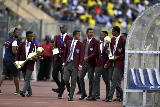 Clapham High School players, who defended the Copa Coca-Cola trophy last month, parade the silverware during the match between Sundowns and Wits recently. / Frennie Shivambu / Gallo Images