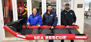 Stretcher manufacturer Marcus van Deventer, with the NSRI's Marc Rodgers and Robbie Gibson.