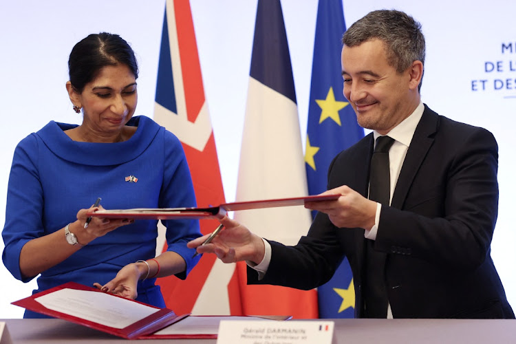 French Interior Minister Gerald Darmanin and Britain's Home Secretary Suella Braverman sign a joint declaration signature at the Hotel Beauvau Interior Ministry in Paris, France November 14, 2022.