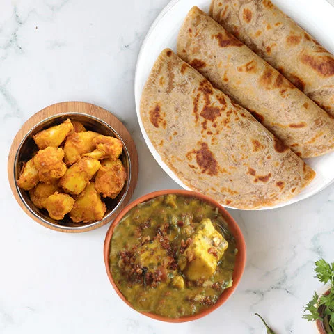 Lasooni Methi Paneer, Aloo Gobhi & Paratha Thali