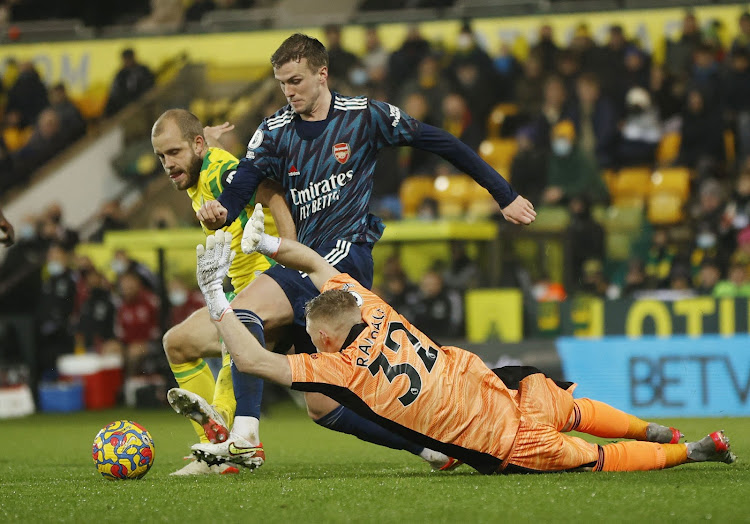 Norwich City's Teemu Pukki in action with Arsenal's Rob Holding and Aaron Ramsdale.