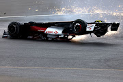 Zhou Guanyu crashes at the start during the F1 Grand Prix of Great Britain at Silverstone on July 03, 2022 in Northampton, England.