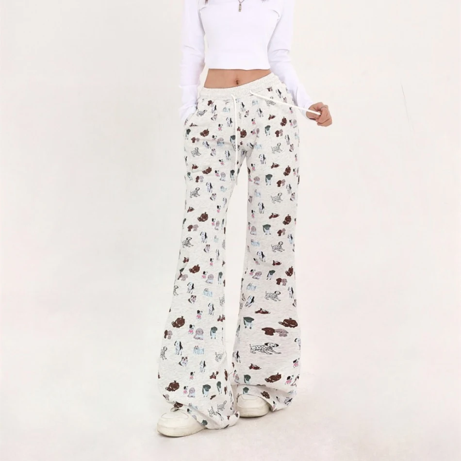 Pantalon de survêtement ample à taille élastique et imprimé, idéal pour le sport et les activités décontractées, confortable et stylé.
