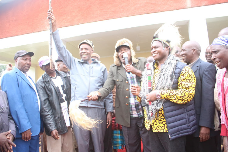 UDA Governor candidate Ezekiel Machogu (Holding walking stick) with senator candidate Joash Maangi during a function on Tuesday