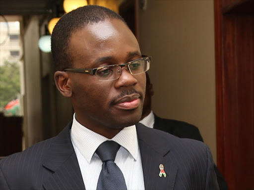 Senators Hassan Omar and Moses Kajwang chat with Homa Bay governor Cyprian Awiti after he appeared before the Senate Public Accounts committee