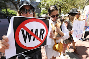 A group of Ukrainian citizens protest outside the Russian embassy in Cape Town on February 25 2022. They are calling for a stop to Russia's incursion into Ukraine. 