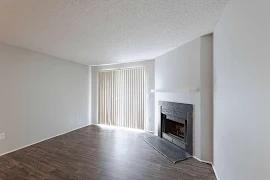 Living room with fireplace and patio doors