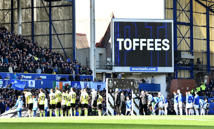 Everton and Burnley players line up before the Premier League match at Goodison Park in Liverpool on Saturday.