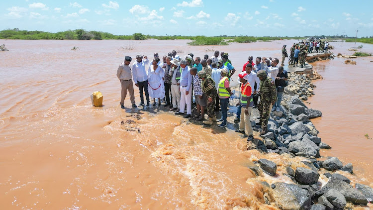 Transport Cabinet Secretary Kipchumba Murkomen with the Lamu leadership during the inspection of the Lamu-Witu-Garsen road that has been swept away by floods.