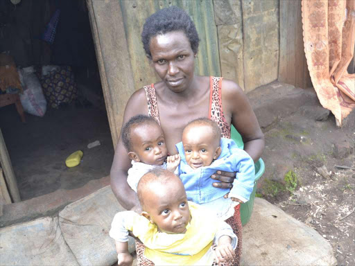 Eunice Jeptoo with her triplets in Nandi-Hills town. PHOTO BY BARRY SALIL