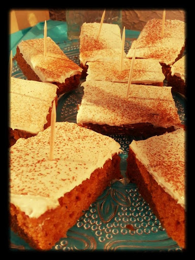 Carrot bars, cut and put on a platter.  Garnished with cinnamon.  The tooth picks are to help pick the bars up and keep people from touching other bars than the one they picked. xo