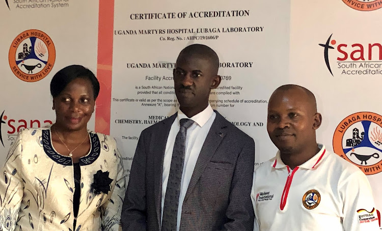 From left to right; Dr. Susan Nabadda ,Commissioner, National Health Laboratory services, Lubaga Hospital Director Dr. Julius Luyimbazi and Dr. Alex Kiseka the labaratory manager at Uganda Martyrs hospital Lubaga