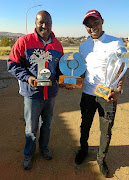 Legendary footballer Sidwell Maboe and his son Lebohang of Mamelodi Sundowns proudly display Lebo's awards.