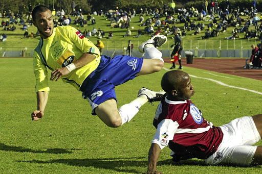 Ex-Downs star Dillon Sheppard, tackled here by Ramahlwe Mphahlele, then of Swallows in this file photo, reckons Thapelo Morena will be back soon. / Lefty Shivambu / Gallo Images