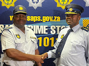 National police commissioner Gen Fannie Masemola (left) with newly appointed Gauteng police commissioner Lt-Gen Tommy Mthombeni.  