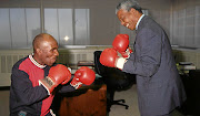 Baby Jake Matlala, left, was one of Nelson Mandela's favourite boxers. They are seen here 'sparing'. 