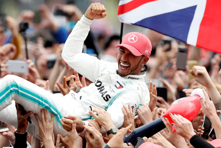 A file photo of Mercedes' Lewis Hamilton celebrating with the Silverstone crowd during the 2019 British Grand Prix.