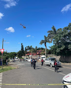 A 'taxi owner' was shot dead and a 10-year-old child injured outside Lotusville Primary School in Lotusville on Wednesday afternoon.